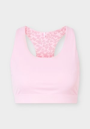 Hellrosa Sport-BH im Racerback-Stil mit Innenstoff, der ein dunkleres rosa Herzmuster aufweist, flach auf grauem Hintergrund.