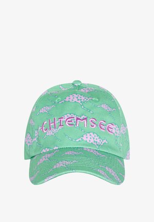 Green baseball cap with pink spotted dinosaur patterns and pink embroidered text "CHIEMSEE" on the front.