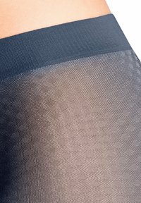 Calze velate con un design testurizzato, caratterizzate da una cintura scura e una transizione gradiente da tonalità scure a chiare.
