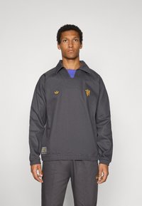 adidas Originals MANCHESTER UNITED ICON - Outdoorjakke - utility black