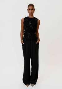 CELINAIC - Tygbyxor - black