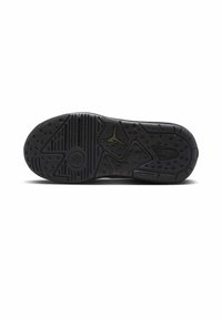 Czarna podeszwa sportowego buta z teksturowanymi wzorami, okrągłymi uchwytami i wyraźnym logo. Zaprojektowana dla przyczepności i stabilności.