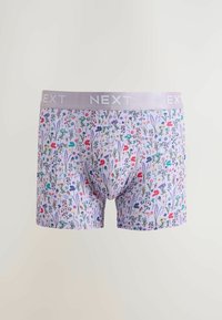 Boxers pour hommes avec une base violet clair, un imprimé floral multicolore, et une ceinture lavender portant le nom de la marque « NEXT » en blanc.