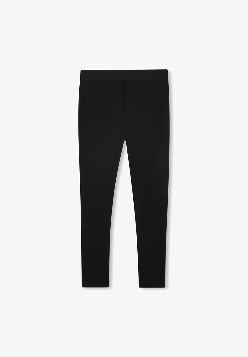 Leggings noirs en tissu extensible avec une taille plate. Le design est ajusté avec une texture lisse et sans motifs visibles.