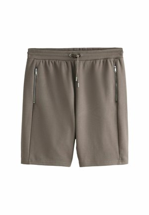 Taupe'i värvi põlveni ulatuvad lühikesed püksid, millel on elastne vöökoht, reguleeritav nöör ja kaks vertikaalset lukuga taskut ees.