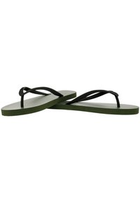 Green flip-flops with textured sole and black thin straps. The sole is flat and wide, providing a casual, comfortable design.