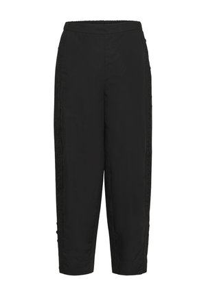 Mustad lahtised püksid elastse vöökohaga ja peene tikandiga välisääre õmblustel.