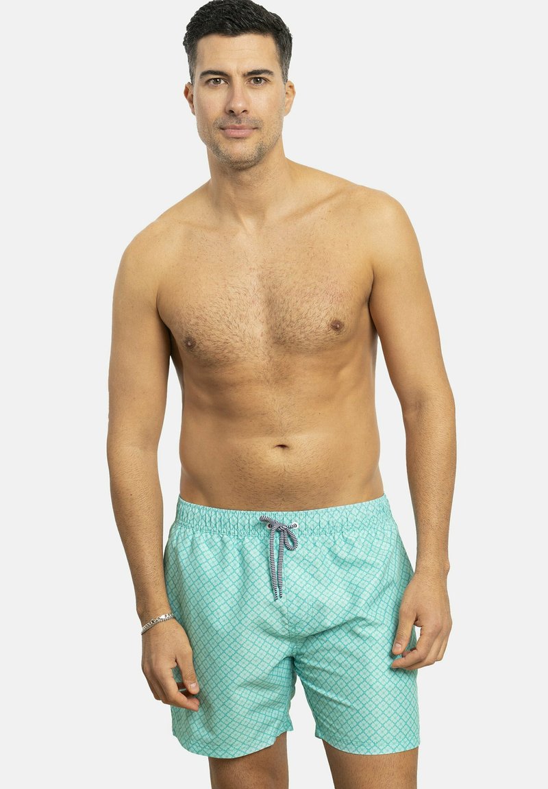 Bañador azul claro de poliéster, con un patrón de diamantes, cinturilla elástica y cordón de contraste.