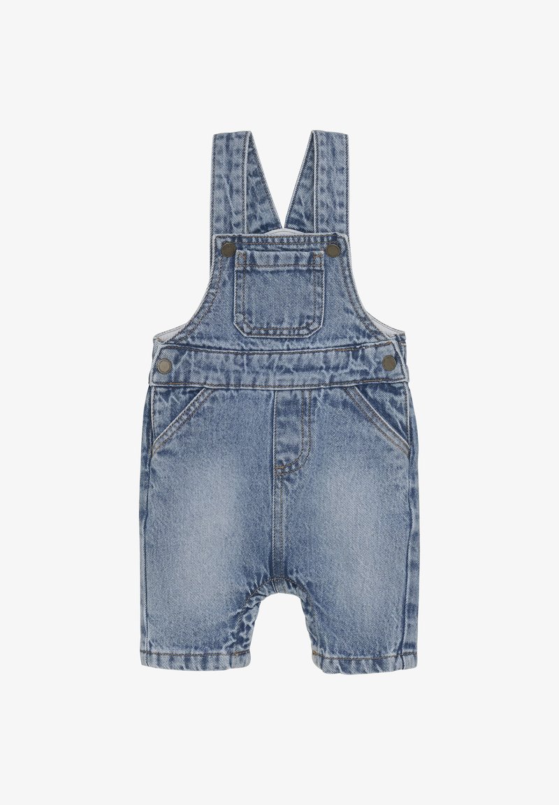 Jeanssalopette met verstelbare banden, voorzien van een voorzak, twee zijzakken en een lichtblauwe wassing met subtiele slijtage-effecten.