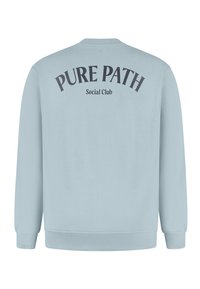 Light blue sweatshirt with long sleeves, ribbed cuffs, and hem; features black text "PURE PATH" and "Social Club" on the back.