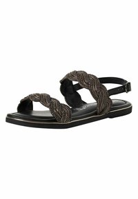 Sorte flade sandaler har flettede metalliske remme, en glat sort fodseng og en justerbar ankelspænde. Teksturerede detaljer tilføjer visuel interesse.
