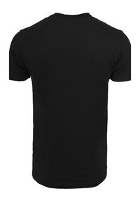 Black cotton T-shirt featuring a round neckline and short sleeves. Smooth texture with a regular fit and no visible patterns or accents.