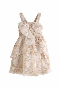Floral-patterned dress in soft beige fabric with layered ruffles and bow accent on the bodice. Features adjustable straps.