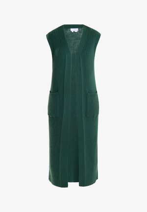 Cardigan lungo senza maniche in maglia a coste verde scuro, con profondo scollo a V e due tasche frontali. Il tessuto testurizzato aggiunge interesse visivo.