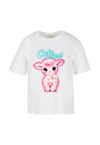 T-shirt en coton blanc avec un imprimé de lapin cartoon rose, aux grands yeux et portant un nœud, accompagné du texte « Cute as Hell » en turquoise.