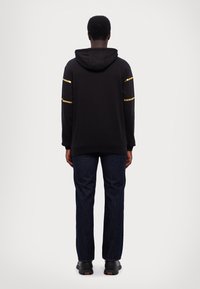 EA7 Emporio Armani TRAIN ATHLETIC HOODIE - Sweatshirt - black/gold