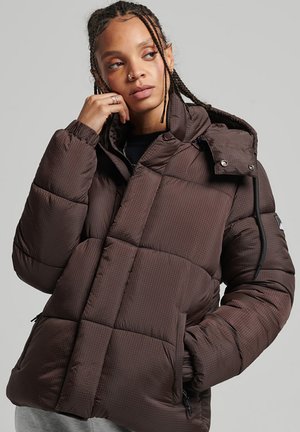 Brown puffer jacket with a checked pattern, insulated squares, attached hood, and zippered pockets. Smooth, glossy exterior texture.