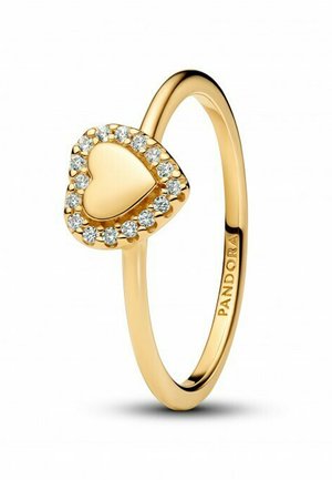 Gold ring with a heart-shaped design encrusted with clear stones around the edge, featuring a smooth polished surface. Engraved "PANDORA."
