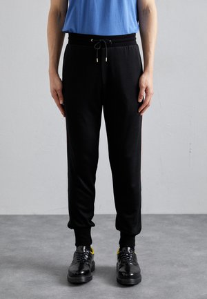 TAPED SEAM JOGGER SLIM LEG - Treniņtērpa apakšdaļas - black