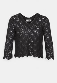 Svart spetsblus med V-ringning, trekvartslånga ärmar och vågig nederkant. Har ett intrikat blommönster och en lätt textur.