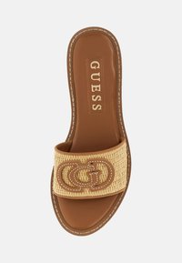 Slip-on sandal with a tan faux leather insole and a woven beige strap featuring a prominent GG logo. Contrast stitching details.
