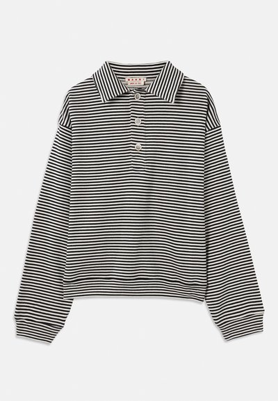 Striped black and white long-sleeve polo shirt with a pointed collar, three-button placket, and elasticized cuffs. Soft fabric texture.