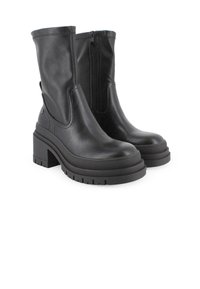 Botas de cuero negro hasta el tobillo con una gruesa plataforma, punta redonda y cremallera lateral. Suela texturizada para mayor agarre y estabilidad.