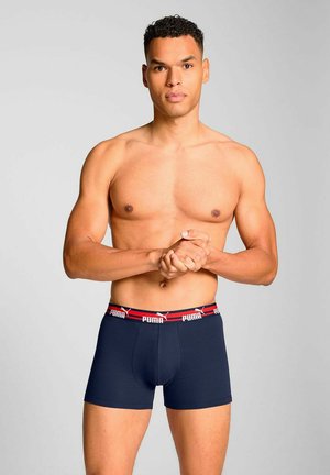Puma navy boxer briefs with a red and white elastic waistband; snug fit, cotton material, minimal design without patterns.
