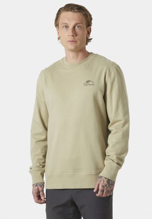Sudadera beige con cuello redondo, mangas largas y un sutil logo en el pecho, fabricada en suave material de algodón.