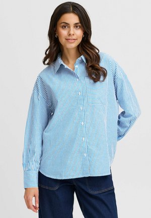 Blue and white striped button-up shirt with a chest pocket, long sleeves, and a relaxed fit. Cotton fabric with soft texture.