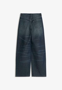 Tmavě modré džíny z denimu s širokým zakončením, které mají jemné efekty vyblednutí, dvě zadní kapsy a kontrastní švy.