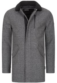 Grå hørmandacto med en sort, plysset krave, frontlommer og en lynlåslomme på brystet. Funktionen har en lige snit og knaplukning.