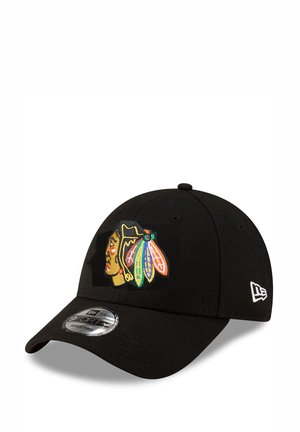 Black cap with a rounded visor. Features an embroidered logo with a Native American design in vibrant colors. Made from fabric with a smooth texture.