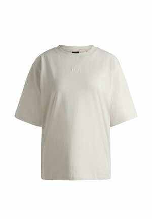 T-shirt en coton couleur crème avec des manches courtes, un col rond et une inscription en lettres texturées discrètes "BOSS" sur l'avant. Tissu lisse sans motif.