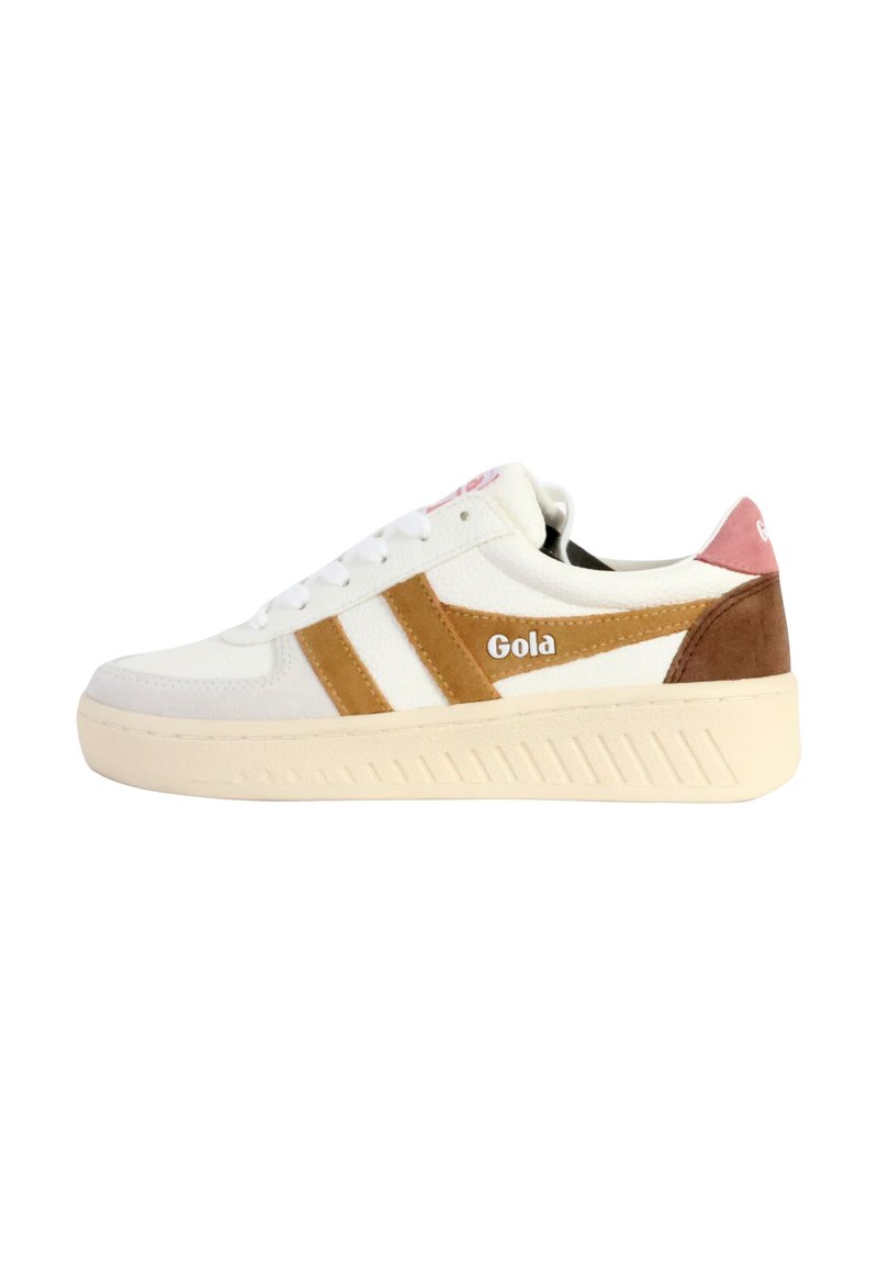 Zapatilla blanca con detalles en marrón y rosa, que presenta una parte superior texturizada, suela gruesa y un logo en el lateral y la lengüeta.
