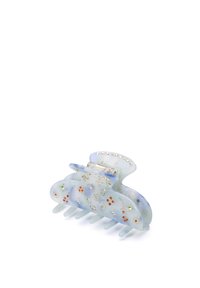 Transparent blå hårklämma med blommönster och flerfärgad stenaccent. Har en böjd form och sammanlänkade tänder för grepp.