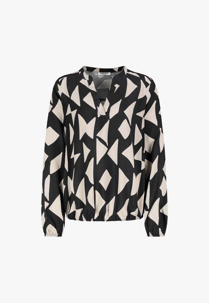 Black and cream blouse with abstract geometric patterns, featuring a v-neckline and elasticized hem, made of lightweight fabric.