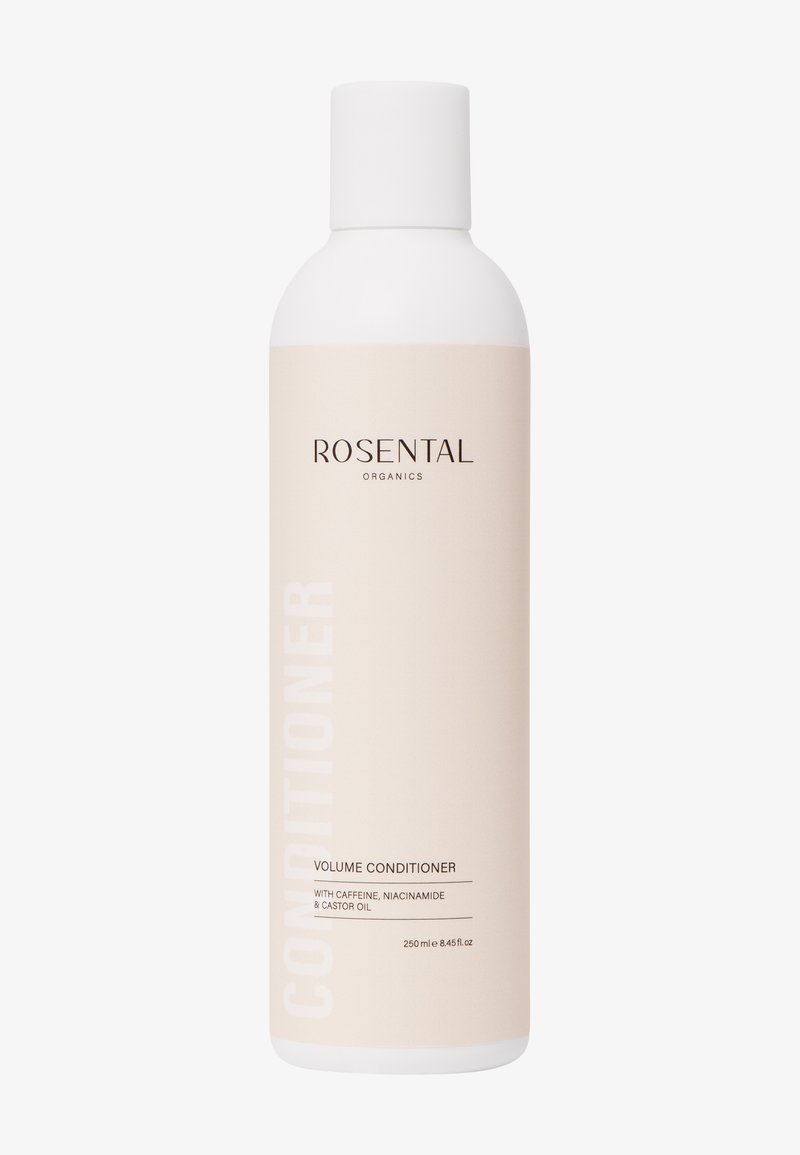Flacon de volumisant Rosental Organics, étiquette beige, contient de la caféine, de la niacinamide, de l'huile de ricin, 250 ml, bouchon blanc, design minimaliste.