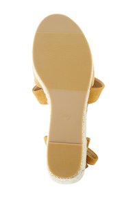 Brown suede sandal sole with a textured pattern. Features a gold accent trim and a printed size "40" inside a circle.