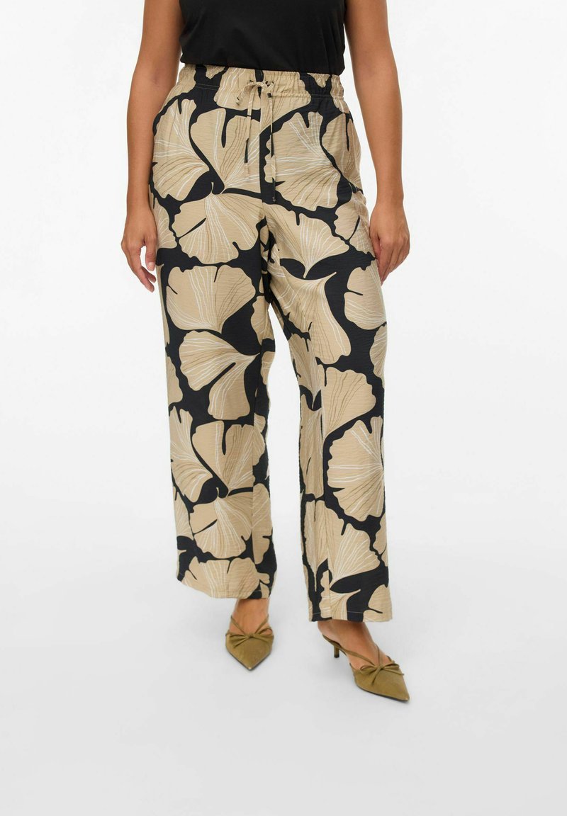 Wide-leg trousers made of fabric with cream floral patterns on a black background. Features an elastic waistband and a relaxed fit.
