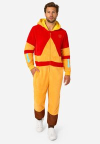 Red and yellow hooded onesie made of soft fleece, featuring a geometric design, front zipper, and contrasting brown cuffs and ankles.