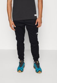 The North Face - REAXION JOGGER - Tracksuit bottoms - black Thumbnail Image 1