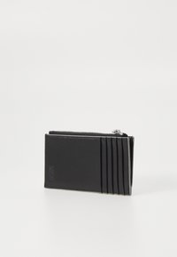 Black leather wallet with a smooth finish, featuring a zip closure and horizontal pleats on one side for card storage.