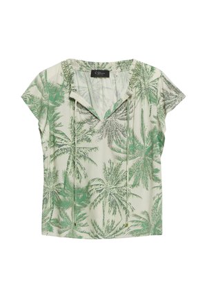 Bluzka z krótkim rękawem w kremowym kolorze z zielonym nadrukiem palm, dekolt w serek z wiązaniami i luźnym krojem.
