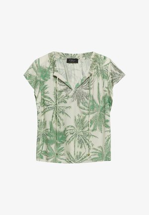 Blouse à manches courtes de couleur crème avec imprimé de palmiers verts, col en V avec liens et coupe décontractée.