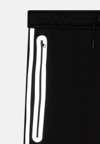 Nike Sportswear TECH - Donji dijelovi trenirke - black/reflective silver