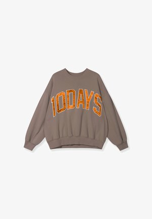 Braun oversized Sweatshirt mit "10DAYS" in leuchtend orangen Buchstaben. Verfügt über einen Rundhalsausschnitt sowie gerippte Bündchen und Saum. Aus weichem Baumwollstoff.