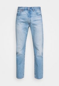 Ljusblå denimjeans med rak passform, knappstängning och femfickdesign. Subtil blekning och texturerad tygdetalj.