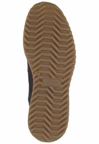 Suela de zapato de goma marrón con un patrón de huella en zigzag. Presenta una marca de tamaño circular "41" y un área etiquetada rectangular.