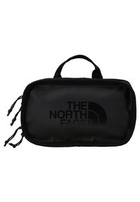 Pochette rectangulaire noire compacte avec poignée, compartiments zippés à l’avant et logo The North Face imprimé en noir sur le devant.
